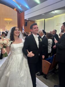 Rabbi Amy Rader officiating her son Caleb's Jewish wedding ceremony under chuppah in South Florida at niboca.org