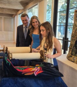 Bat mitzvah student reading from the Torah at The Neshamah Institute in Boca Raton