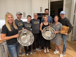 Neshamah Institute volunteers preparing food in the kitchen for a homeless meal service, niboca.org