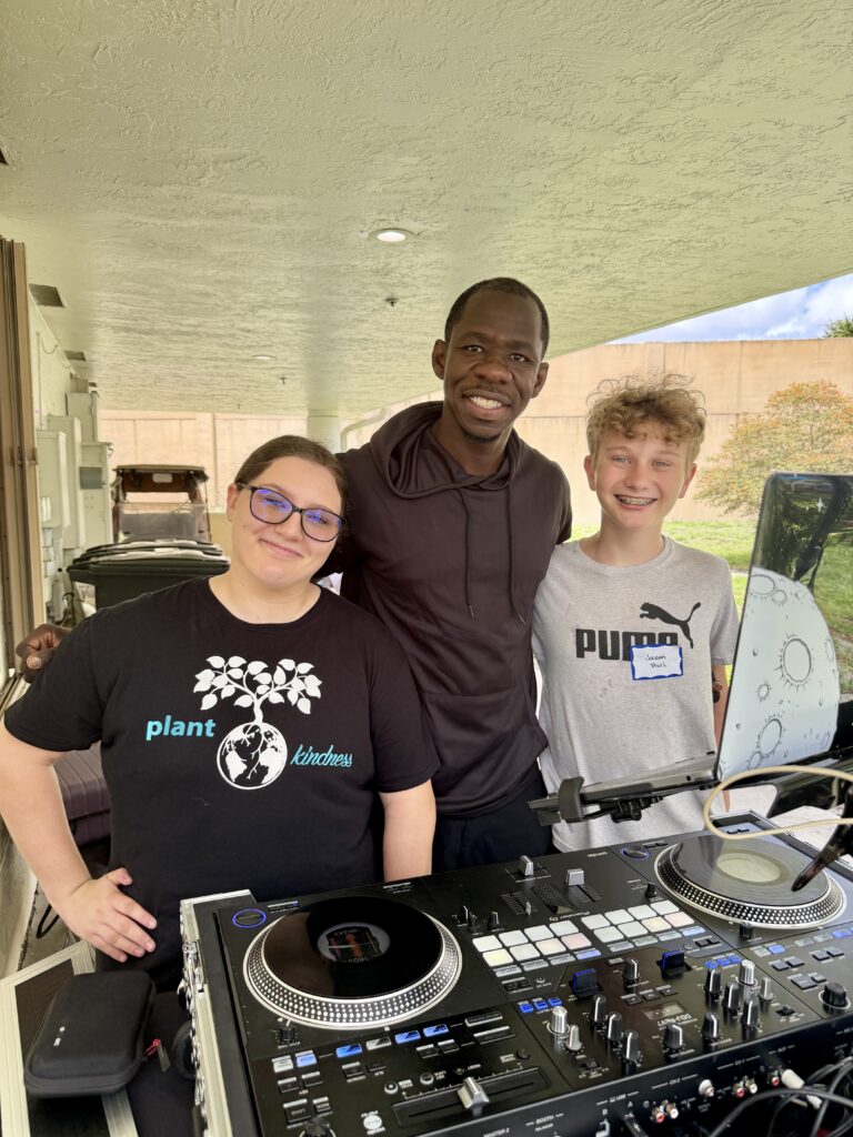 Children enjoying music with a DJ and games with a sports coach at the Neshamah Spring Mitzvah Fair at SOS Children's Village, niboca.org