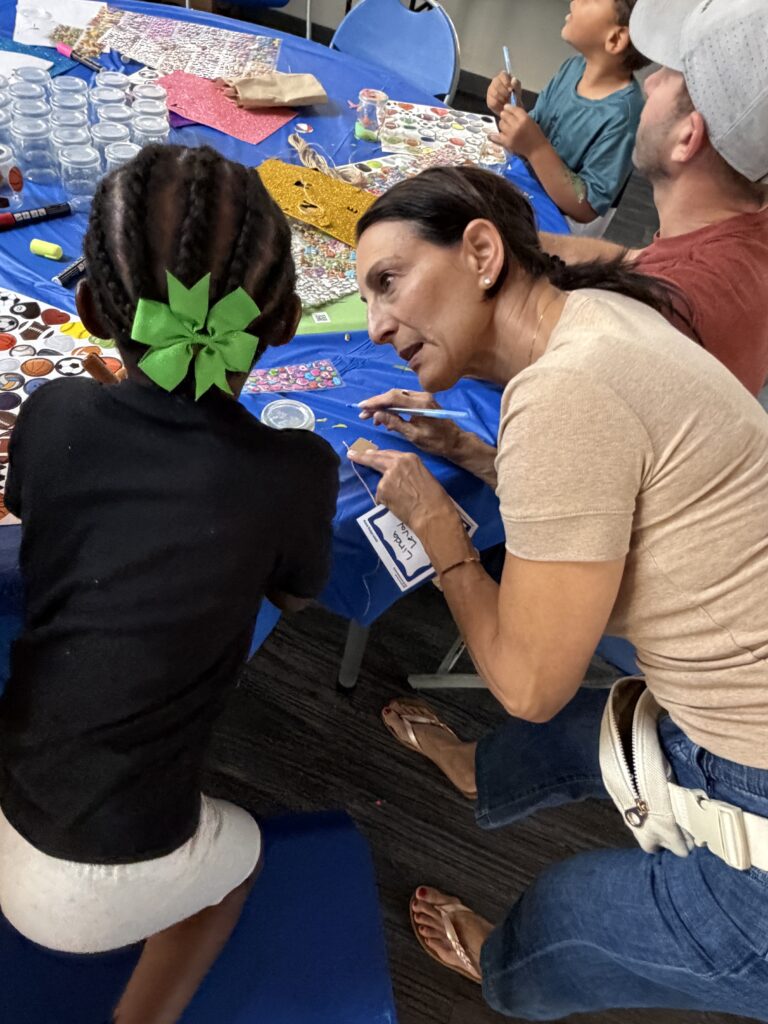 Children decorating gratitude jars at the Neshamah Institute Spring Mitzvah Fair at SOS Children's Village, niboca.org
