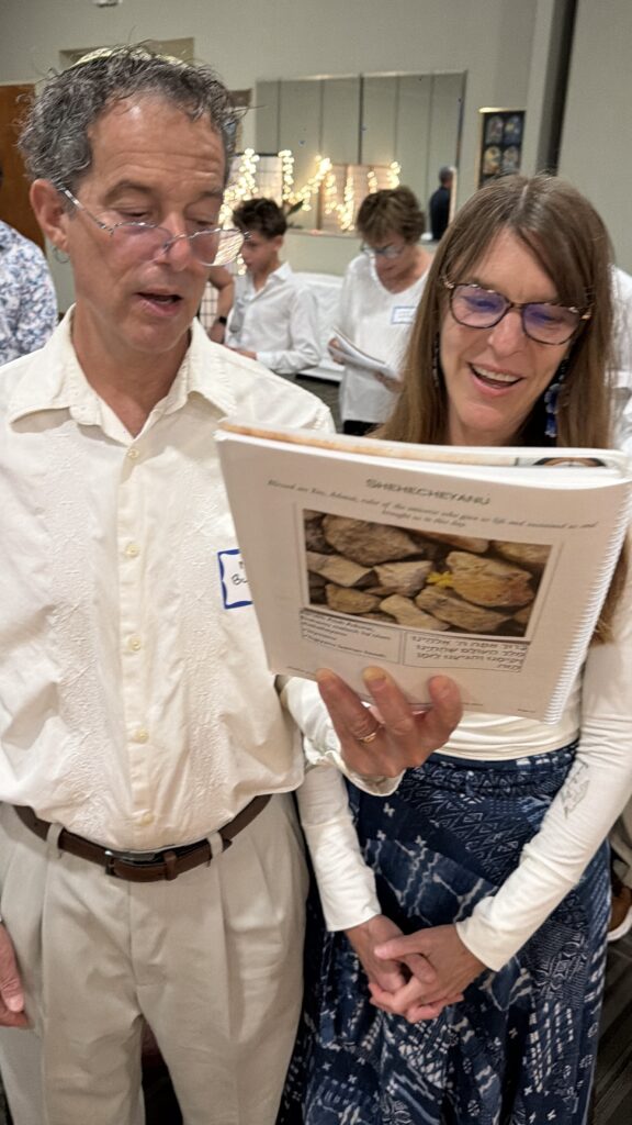Neshamah congregation singing together during Shabbat services in Boca Raton and Delray Beach