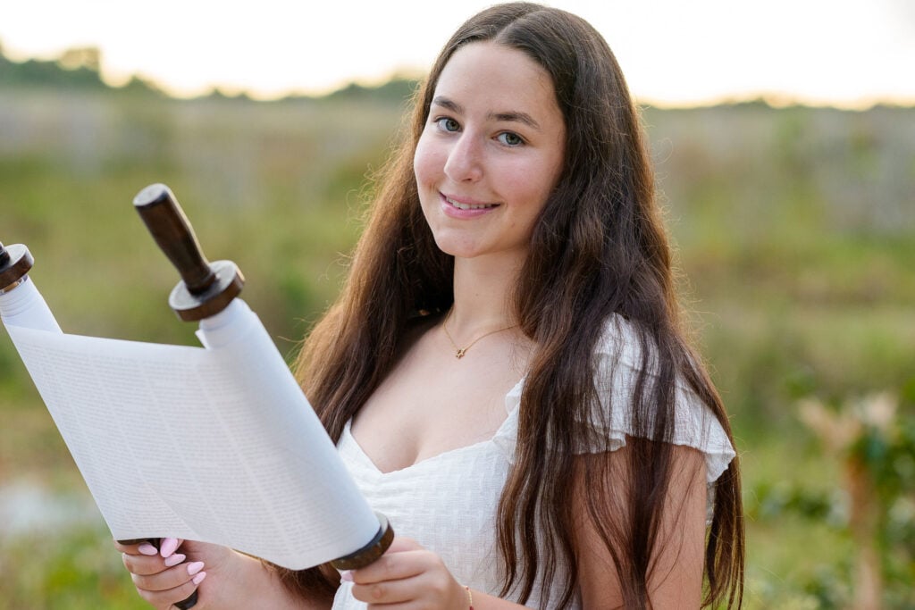 Student reading Torah at their b'nai mitzvah ceremony, niboca.org